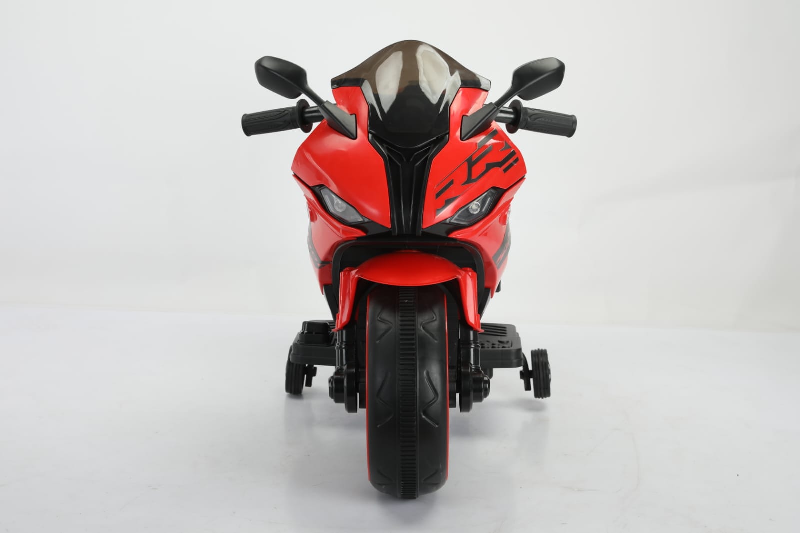 Kids' red electric ride-on motorbike with sleek design, training wheels, and silver engine details. www.usmile.toys