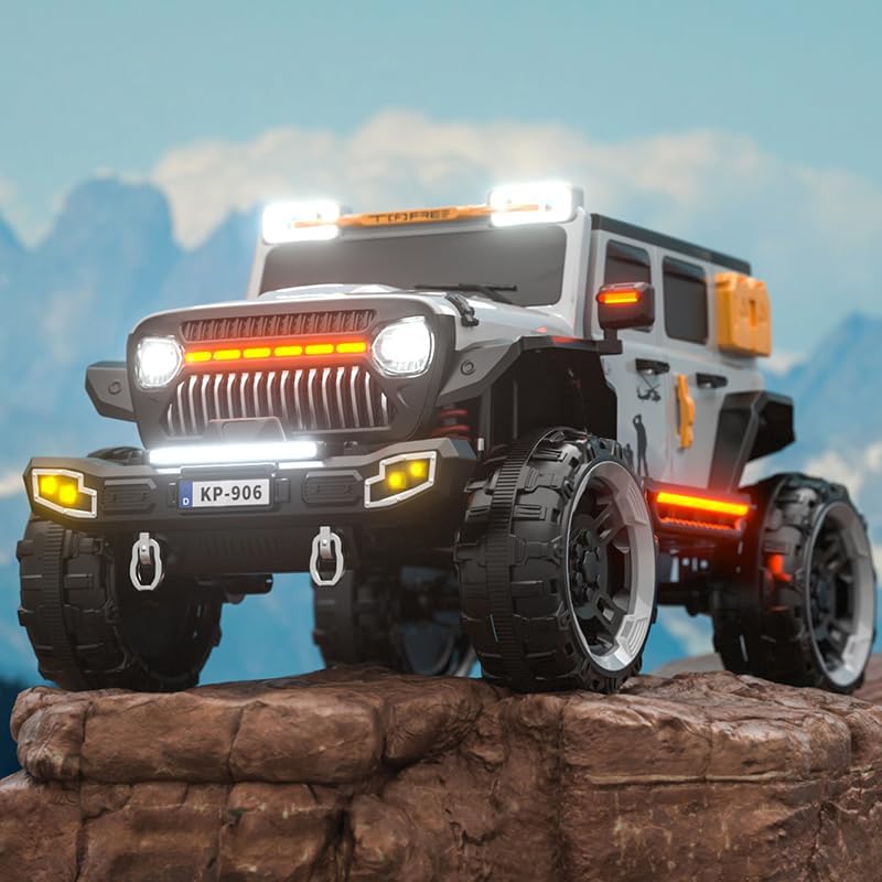 Grey and black battery operated kids jeep ride-on car with orange accents, features working headlights, overhead lights, and underbody glow, on rocky terrain." www.usmile.toys
