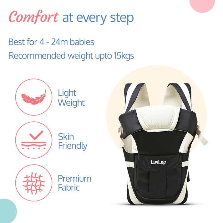 Smiling mother carrying a baby in a black Luvlap Elegant Baby Carrier with beige padding and straps, designed for comfortable and secure babywearing. Shows the baby facing towards the parent. From uSmile.toys." www.usmile.toys