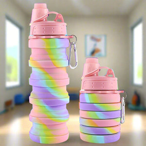 Collapsible rainbow-colored silicone water bottles for kids and adults, with secure lids and metal clips for travel. www.usmile.toys