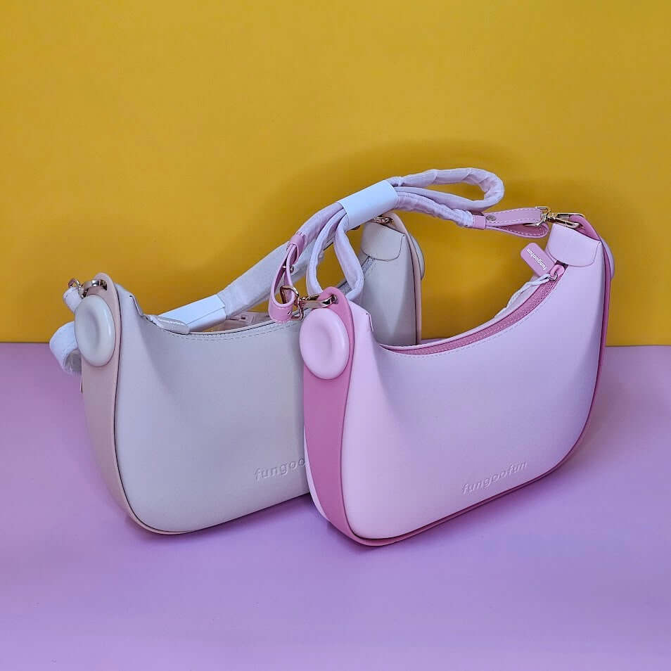 Two pink handbags with a yellow background