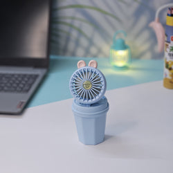 "Usmile Toys portable mini desk fan set for children, designed with an adorable bunny ear top and a compact base, perfect for study or play areas, available in blue and pink." www.usmile.toys