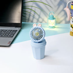 "Usmile Toys portable mini desk fan set for children, designed with an adorable bunny ear top and a compact base, perfect for study or play areas, available in blue and pink." www.usmile.toys