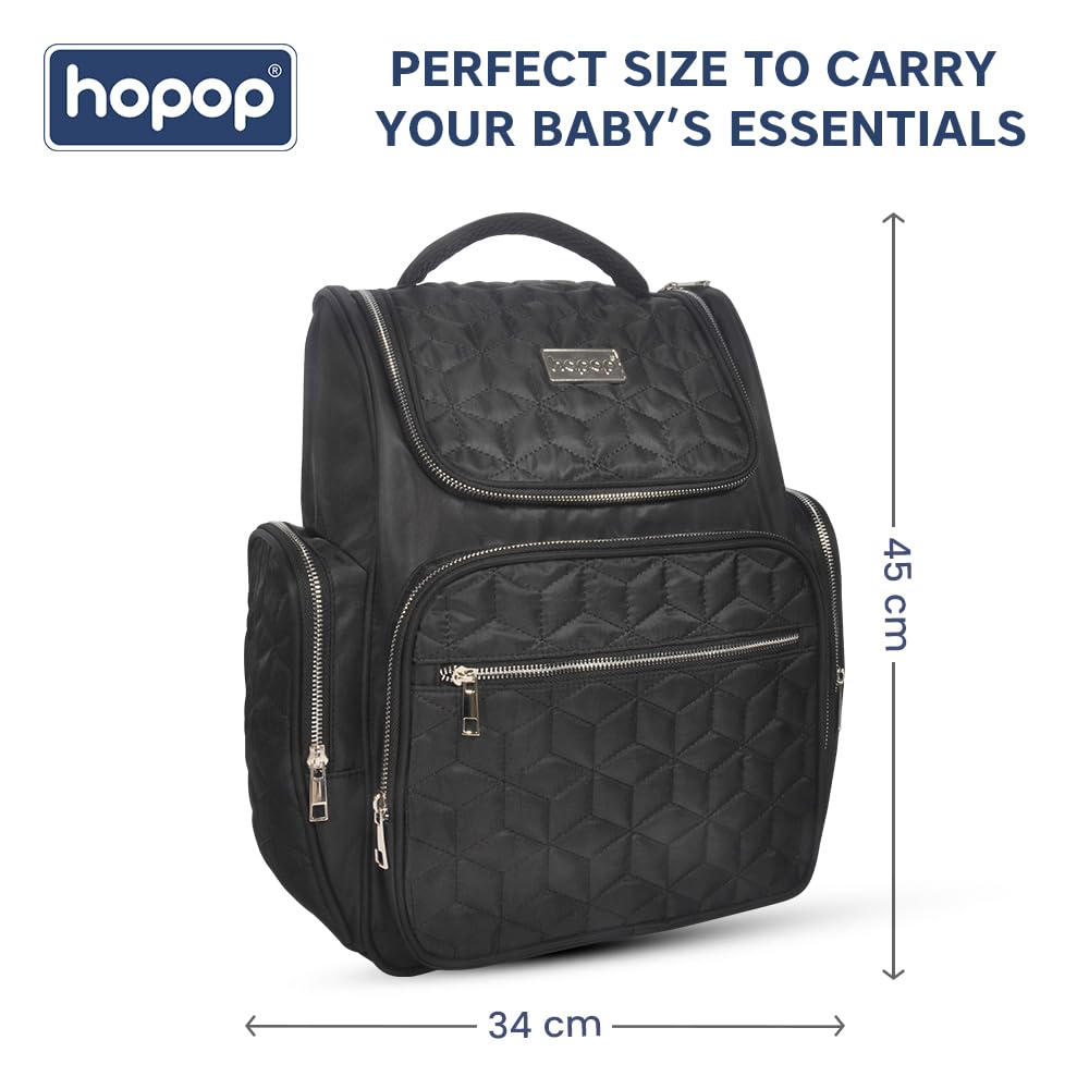 Stylish black textured diaper backpack with multiple zippered compartments and a top handle, perfect for organizing baby essentials. www.usmile.toys