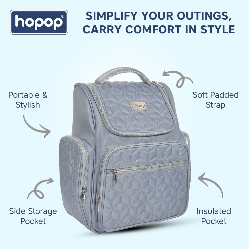 Front view of a black geometric quilted pattern diaper backpack with silver zippers and a subtle brand tag. www.usmile.toys