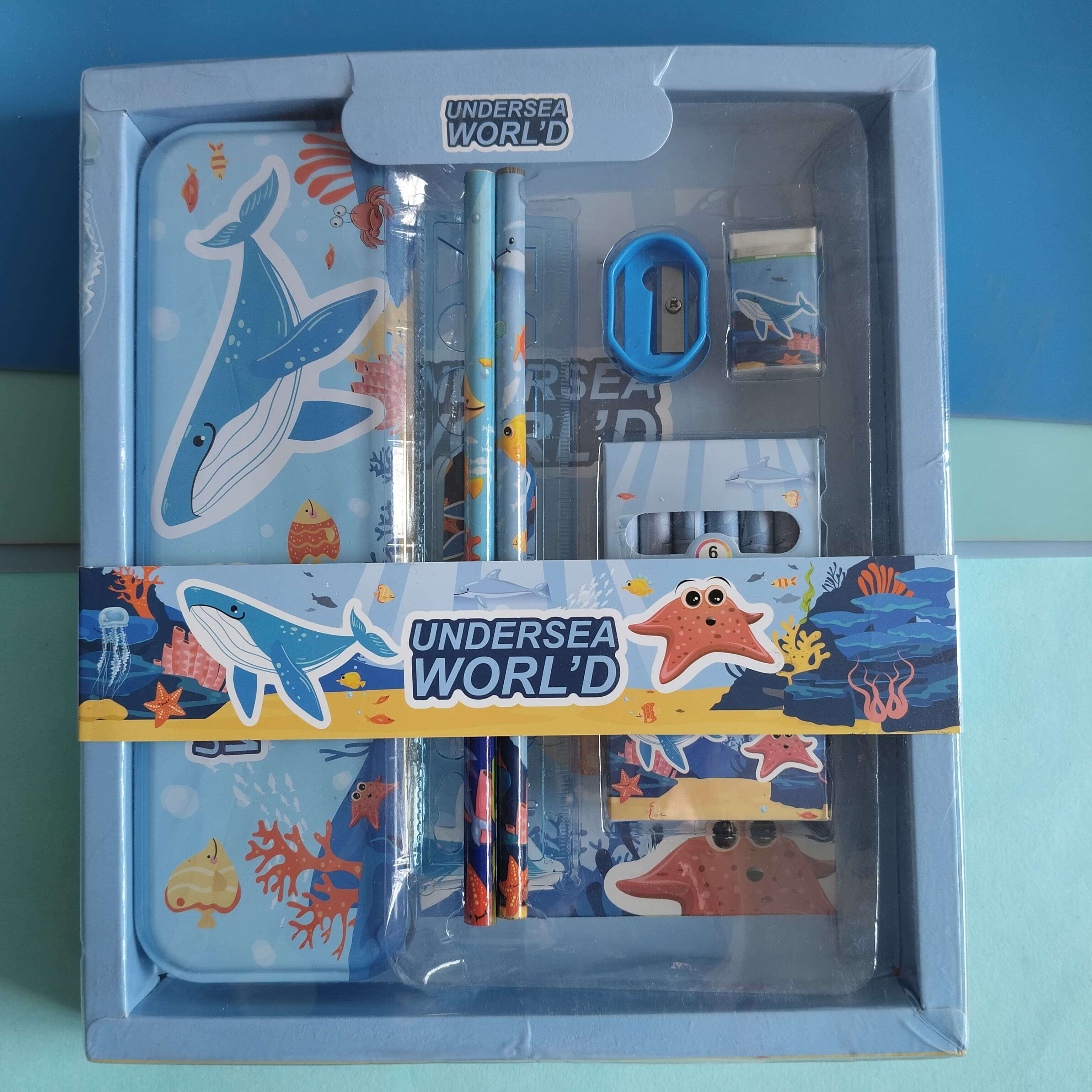 Stationery set with undersea theme packaging on a blue background