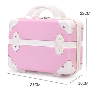 Pink and white kids fashion cosmetic bag for travel, featuring a vintage-style trunk design with white handles and trim. Compact vanity case from www.usmile.toys