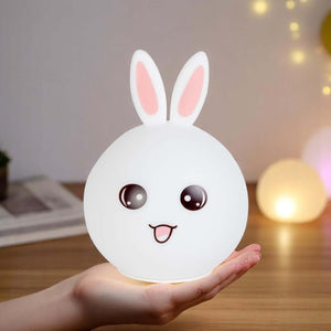 White silicone rabbit night light with pink ears. www.usmile.com