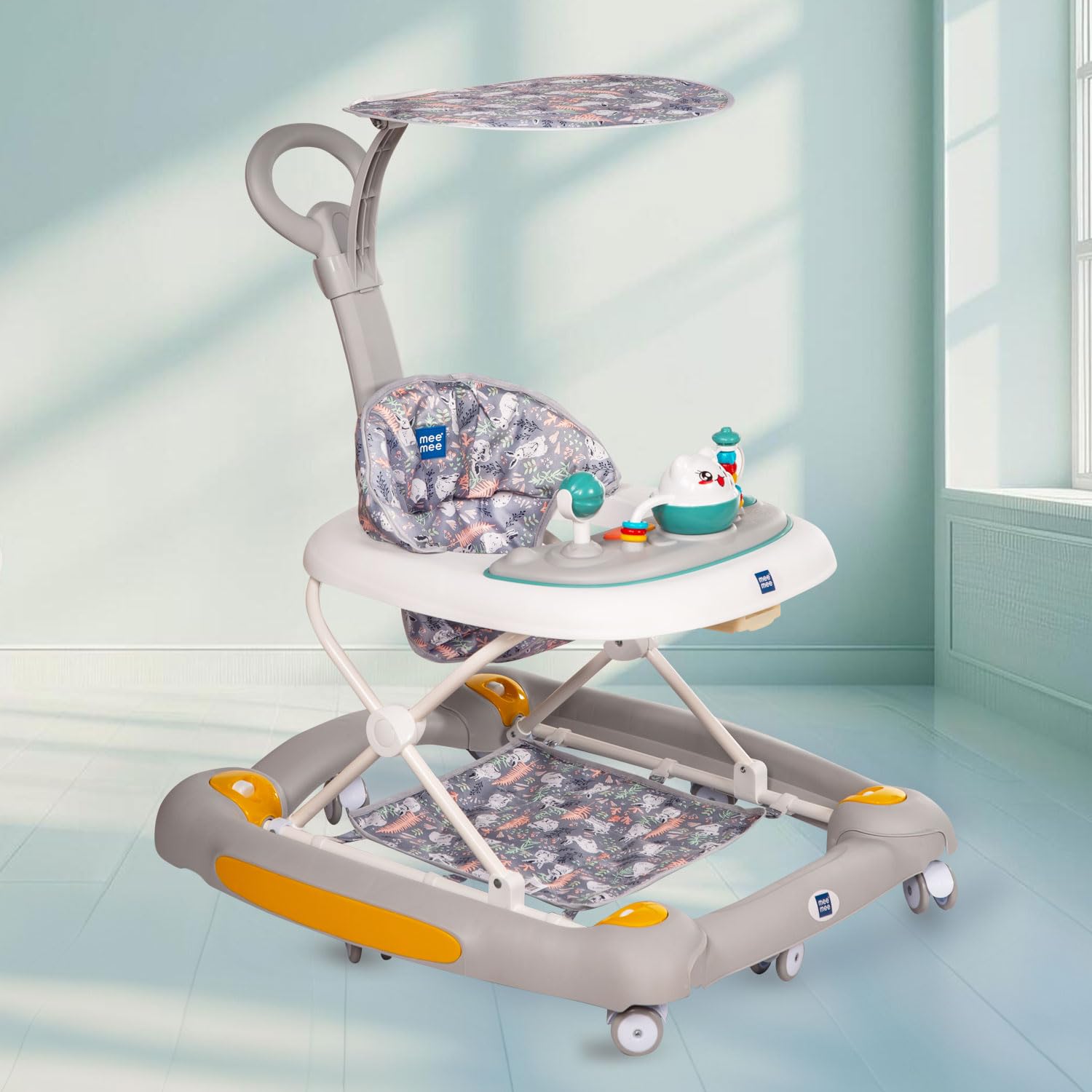 Grey and white Mee Mee baby walker with removable padded seat, adjustable height, and toy tray for infants.
www.usmile.toys