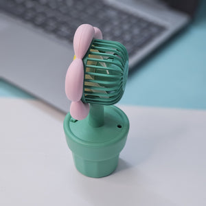 Set of three Usmile Toys flower-shaped mini desk fans in yellow, purple, and pink, each in a green pot with 'smile' text, perfect for kids' rooms or desks."
