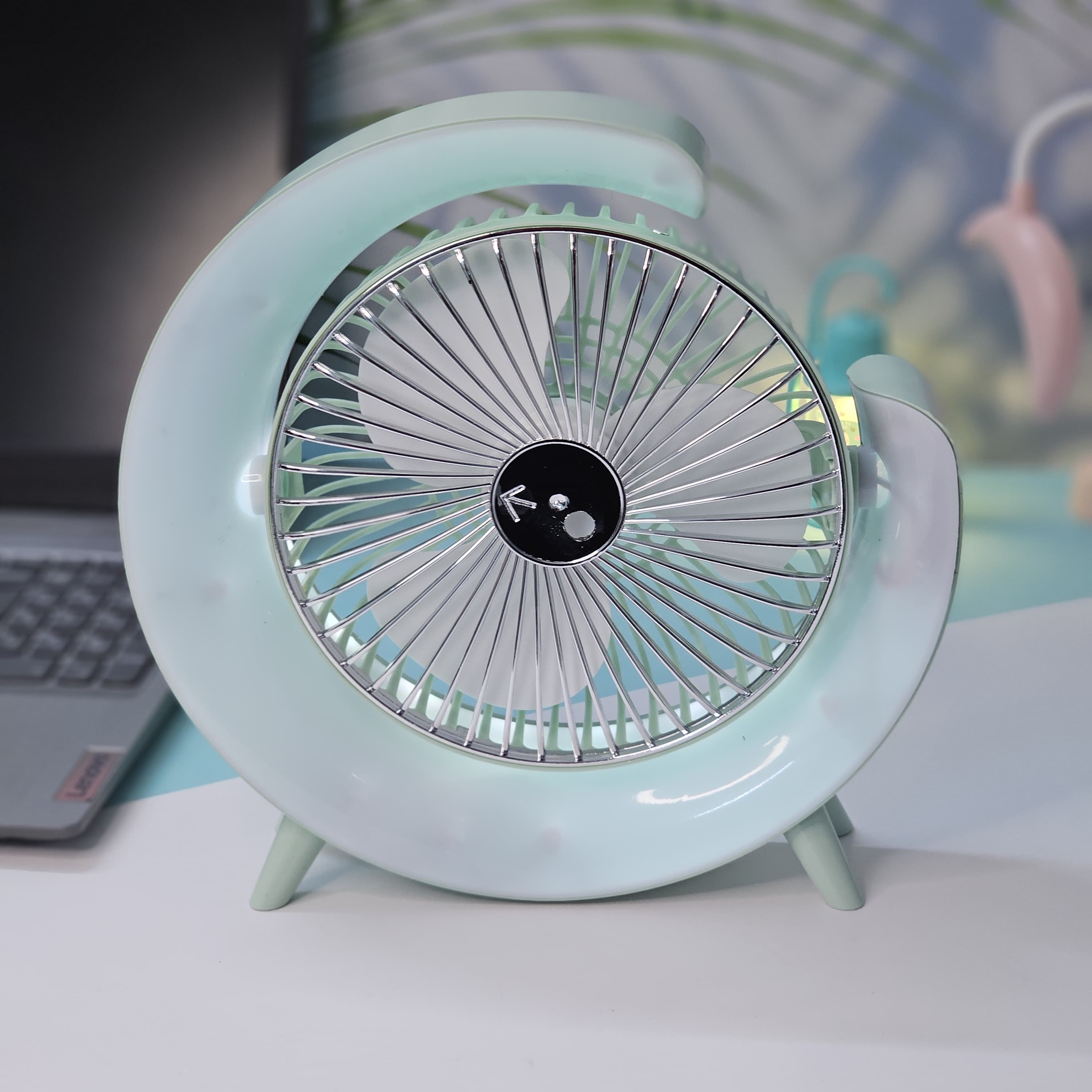 Light blue Usmile Toys moon-shaped high-speed desk fan, featuring a captivating blue LED glow, designed for efficient personal cooling on desktops." www.usmile,toys