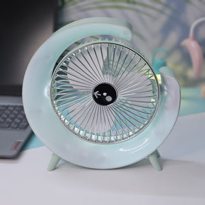 Light blue Usmile Toys moon-shaped high-speed desk fan, featuring a captivating blue LED glow, designed for efficient personal cooling on desktops." www.usmile,toys