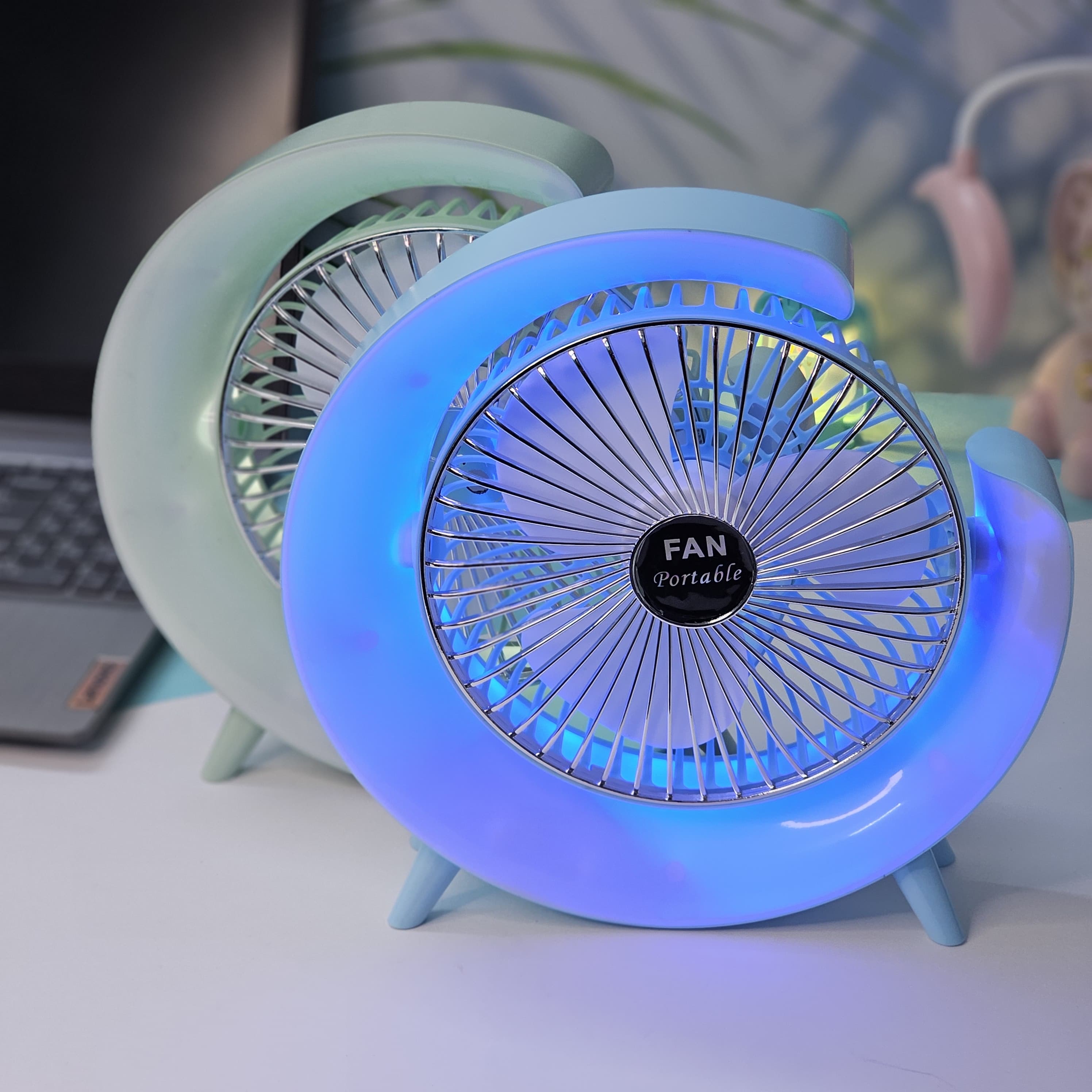"Stylish and functional: a Usmile Toys moon-shaped portable desk fan with LED, ideal for adding both cool air and ambient light to any workspace or bedside table."