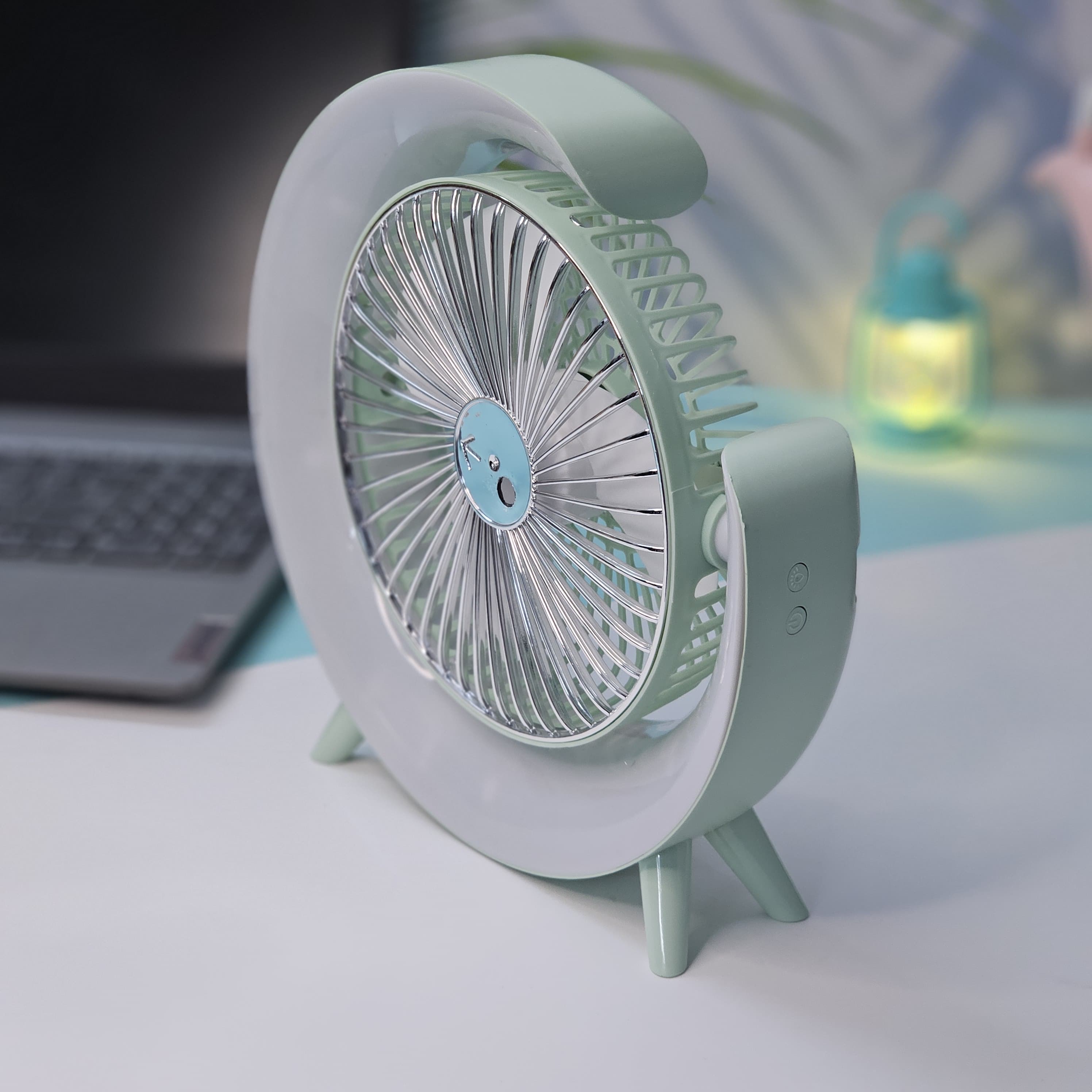 Close-up of a Usmile Toys unique desk fan, showing its light blue curved design, fan blades, and the soft blue illumination from its integrated LED lights."