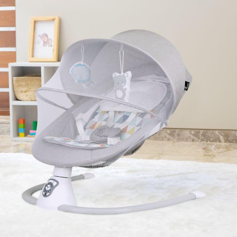 Modern grey Cocoon Smart Auto Baby Swing with a comfortable patterned seat, protective mesh canopy, and dangling toys to engage infants. Designed for soothing motion and hands-free comfort. From uSmile.toys." www.usmile.toys