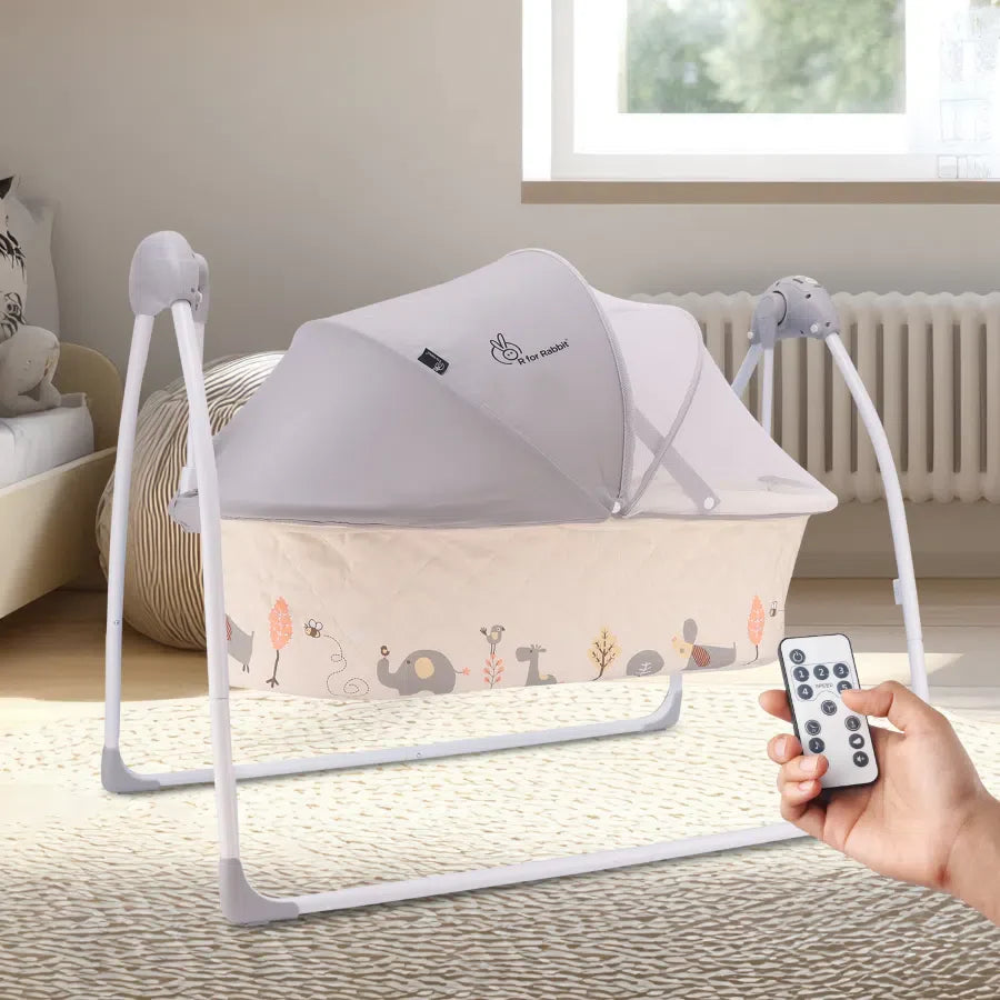 Modern R For Rabbit Lullabies Baby Cradle and Auto Swing in grey and beige, with a protective canopy, mobile, and remote control for automatic swinging. Designed for infant comfort and soothing. From uSmile.toys.
