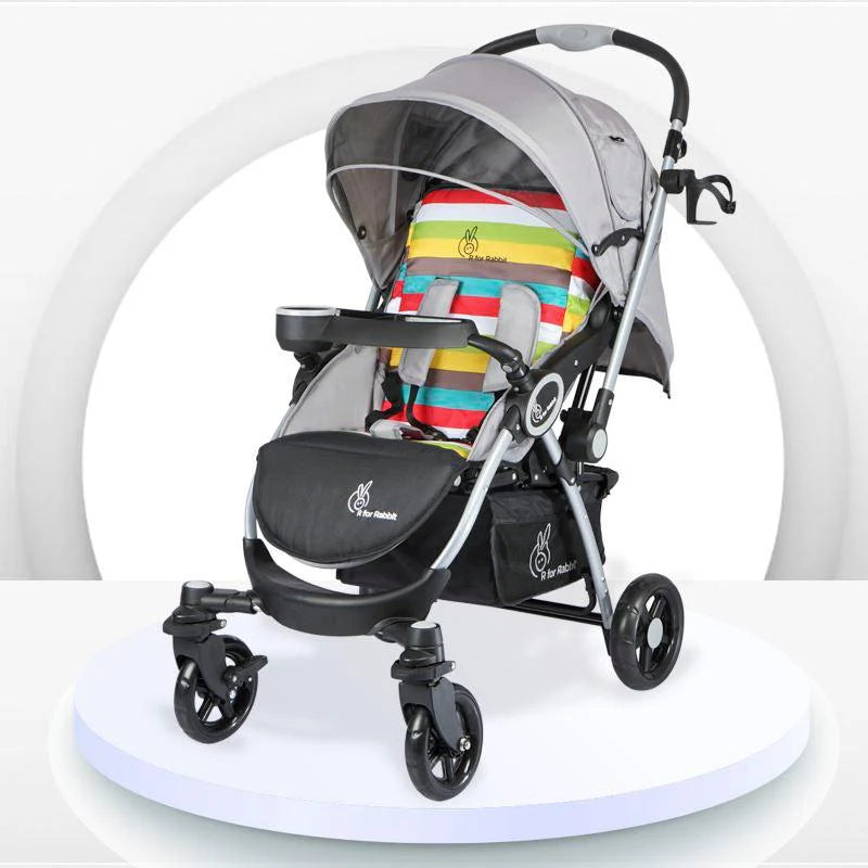Grey R For Rabbit Chocolate Ride Baby Stroller with a multi-colored striped seat cushion, adjustable canopy, cup holder, and a sturdy frame. Designed for comfortable and secure baby travel. From uSmile.toys.