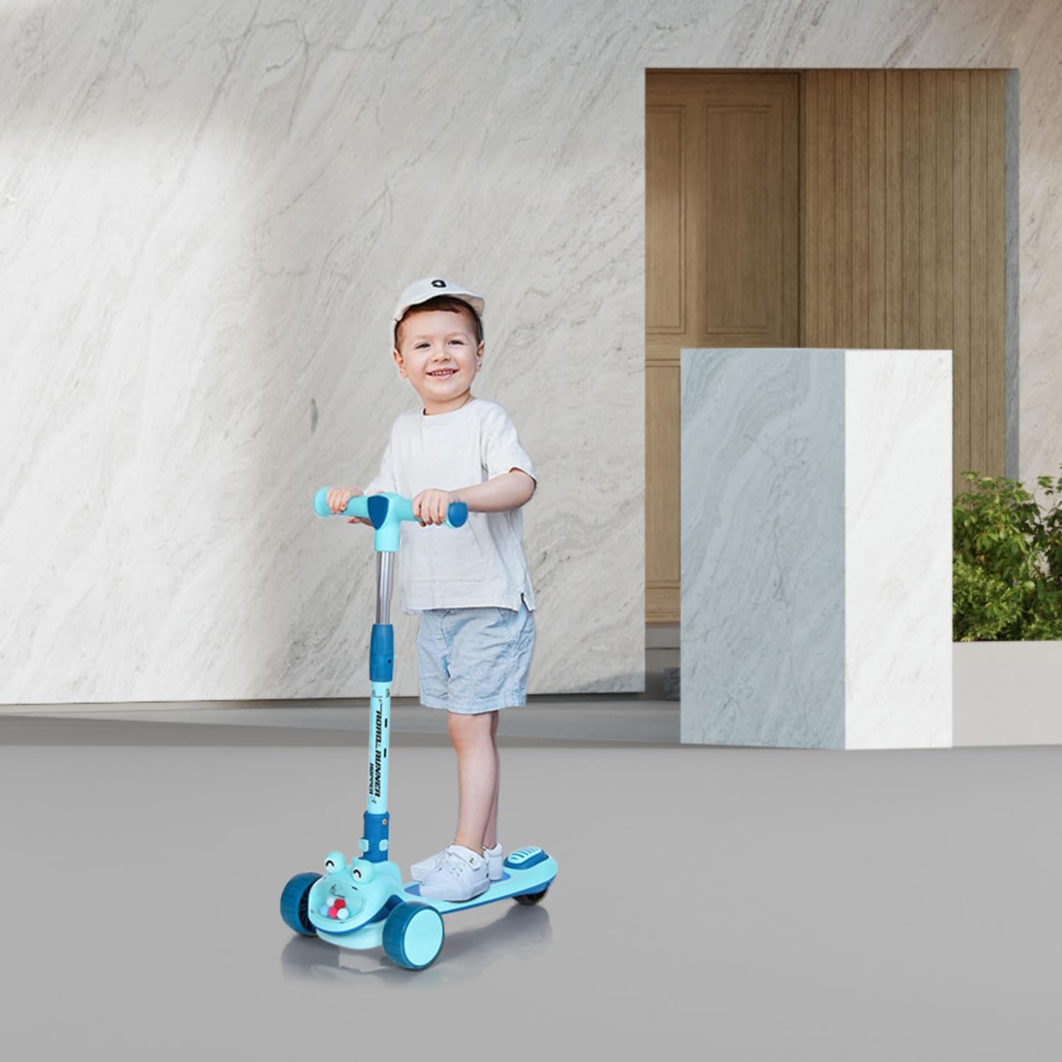 "R for Rabbit Road Runner Hopper 3-wheel Kick Scooter in blue, featuring a foldable design, glowing LED wheels, and a cute 'frog' or 'character' front for engaging fun for kids 3 years and above." www.usmile.toys