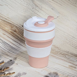 Eco-friendly and portable pink silicone coffee mug, ideal for enjoying hot or cold beverages on the go.www.usmile.toys