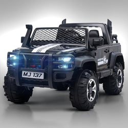 Big baby battery car, a robust black ride-on jeep with functioning headlights, overhead lights, and a realistic design, offering an immersive driving experience for children with  www.usmile.toys