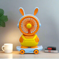 Kids' portable and rechargeable personal fan in a playful teddy bear design with bunny ears, skateboard base, and pencil sharpener. www.usmile.com