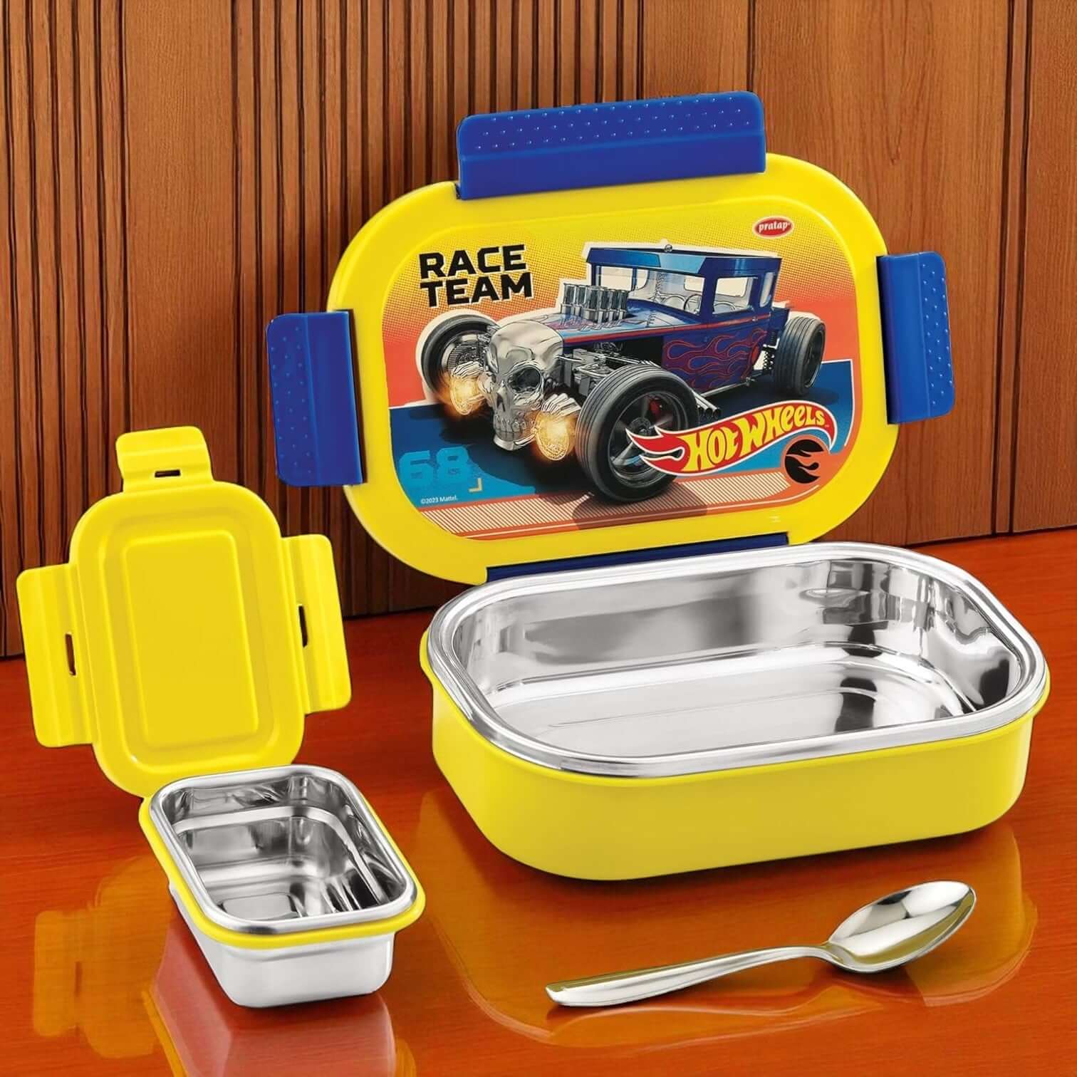 Yellow and blue children's lunch box with Hot Wheels design on a wooden surface