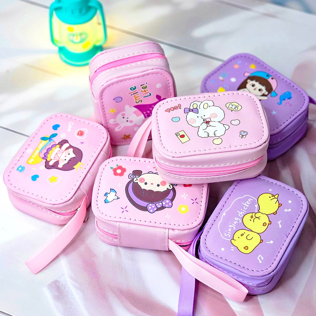 Assorted cute cartoon small storage coin pouches for kids in pink and purple with animal characters. www.smile.toys
