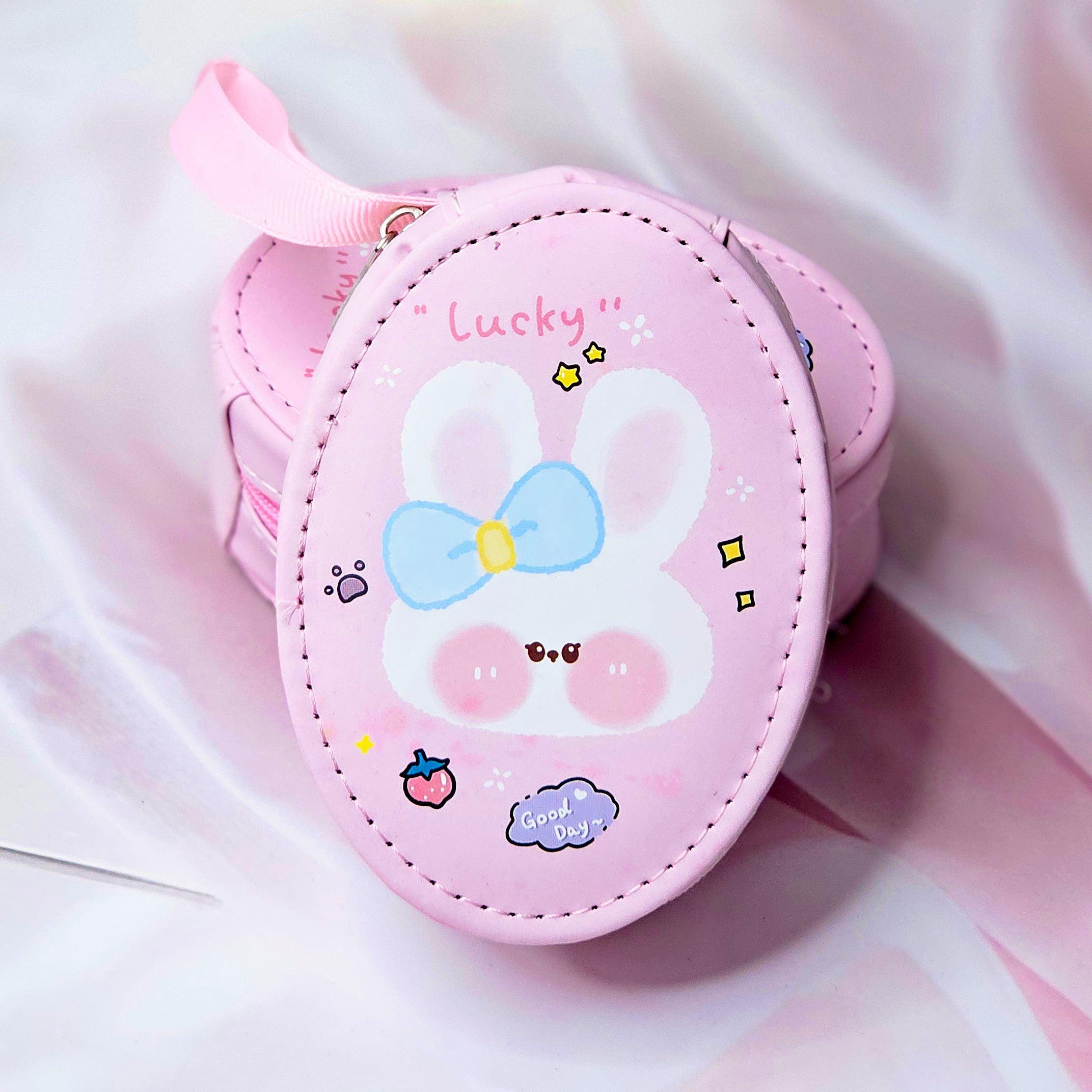 Six colorful cute cartoon oval mini zipper pouches with bear, bunny, duck, cake, and cloud designs, perfect for coins, earphones, and small accessories