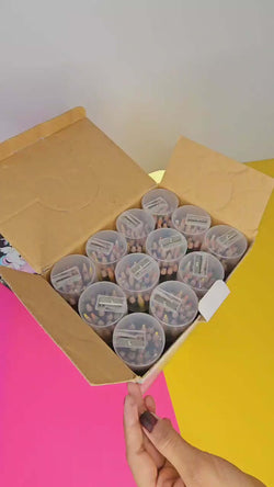 A new set of erasable colored pencils in a colorful, unicorn-themed cardboard box, ready for sketching and coloring by young artists from Usmile Toys.
