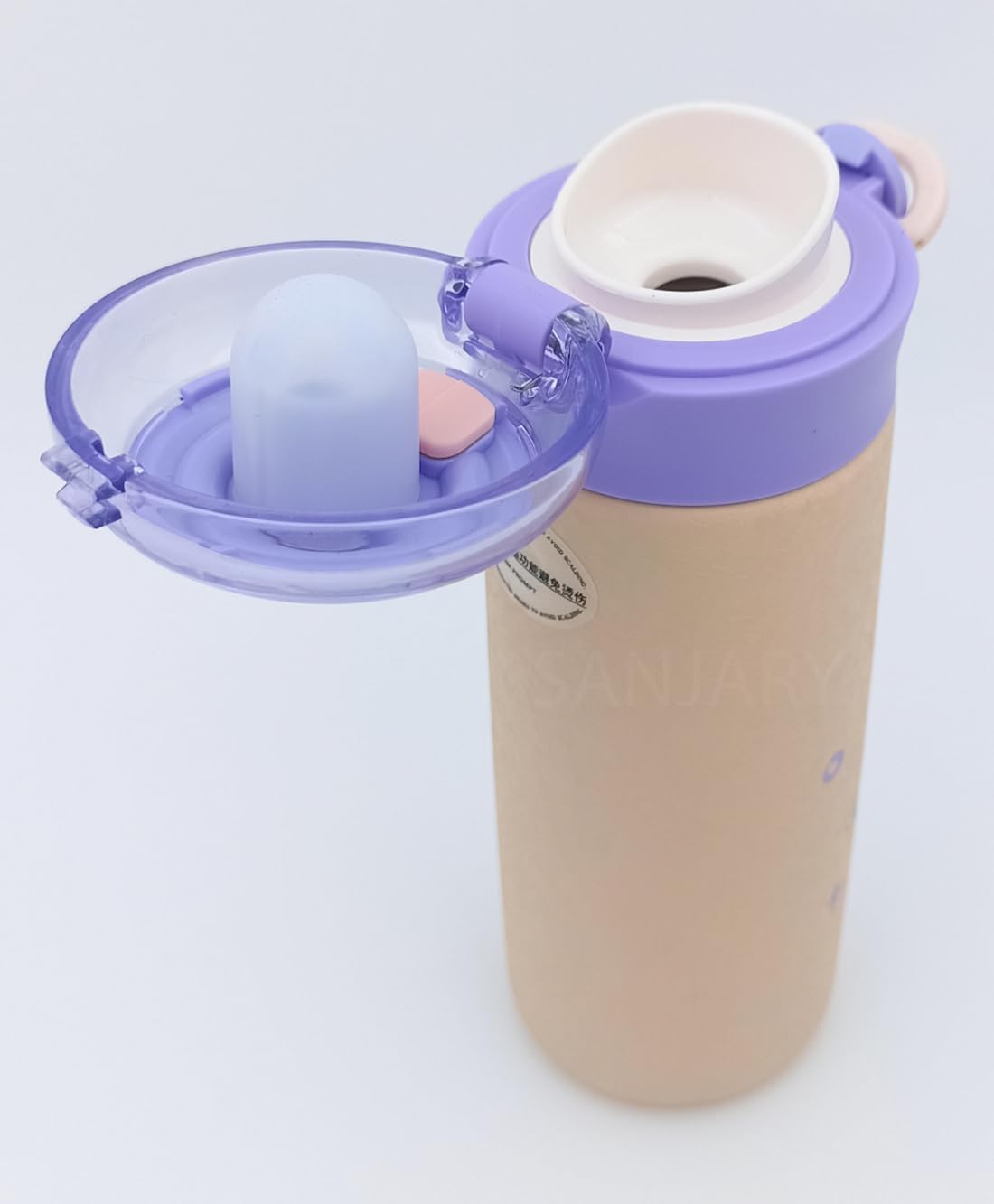 Set of four colorful double-walled vacuum insulated stainless steel bottles for kids, each with a secure flip-top lid and unique astronaut/space-themed cartoon prints in green, blue, purple, and white. Ideal for hot or cold beverages from uSmile.toys." www.usmile.toys