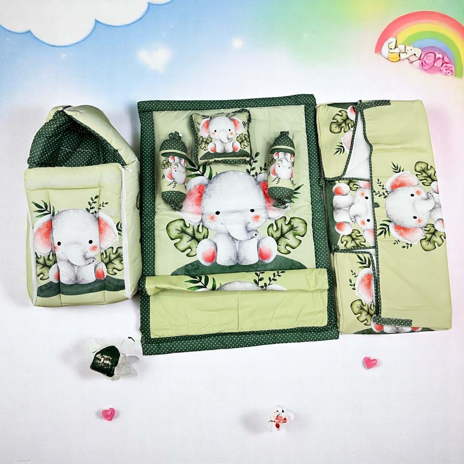 7 in 1 newborn baby bedding combo set in light green with cute elephant and leaf prints. Includes a baby sleeping bag, mattress, two bolsters, pillow, and two zip-up blankets, perfect for comfortable and safe infant sleep. Ideal for baby shower gifts and nursery decor. www.usmile.com