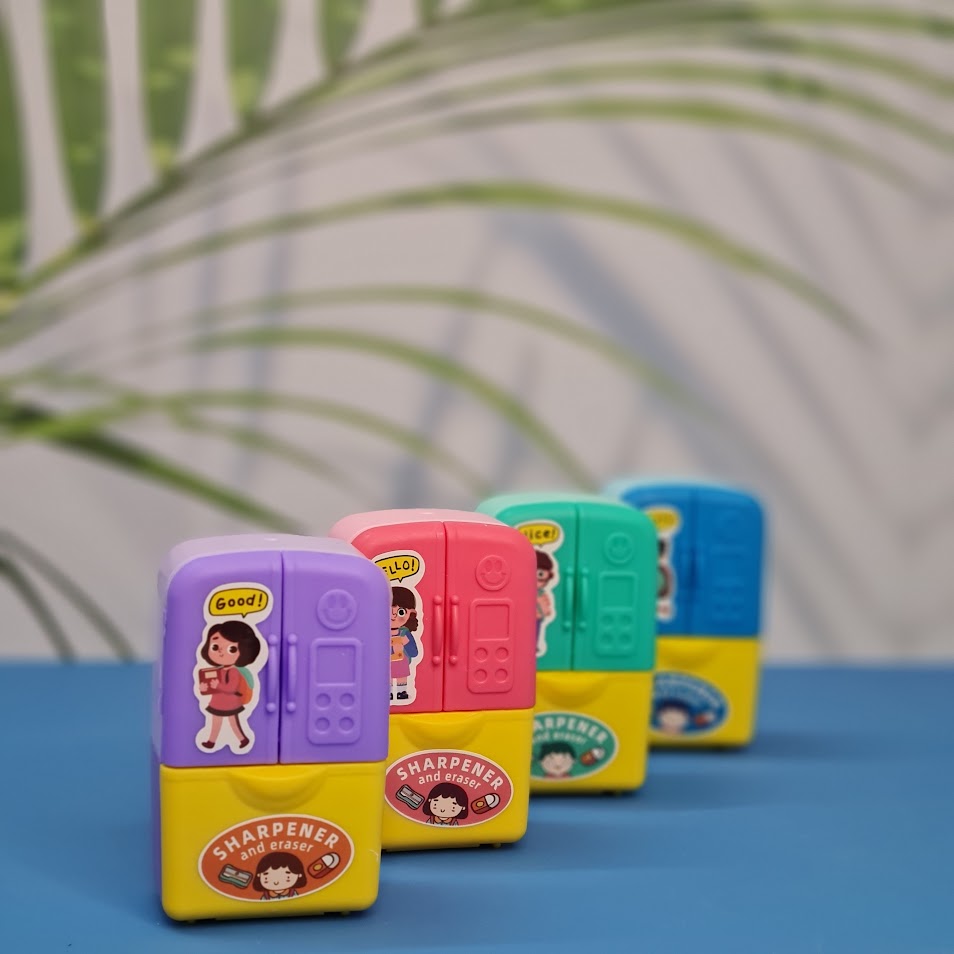 Set of four Usmile Toys adorable fridge-shaped sharpeners and erasers in pink, green, blue, and purple, each with cartoon character decals." www.usmile.toys
