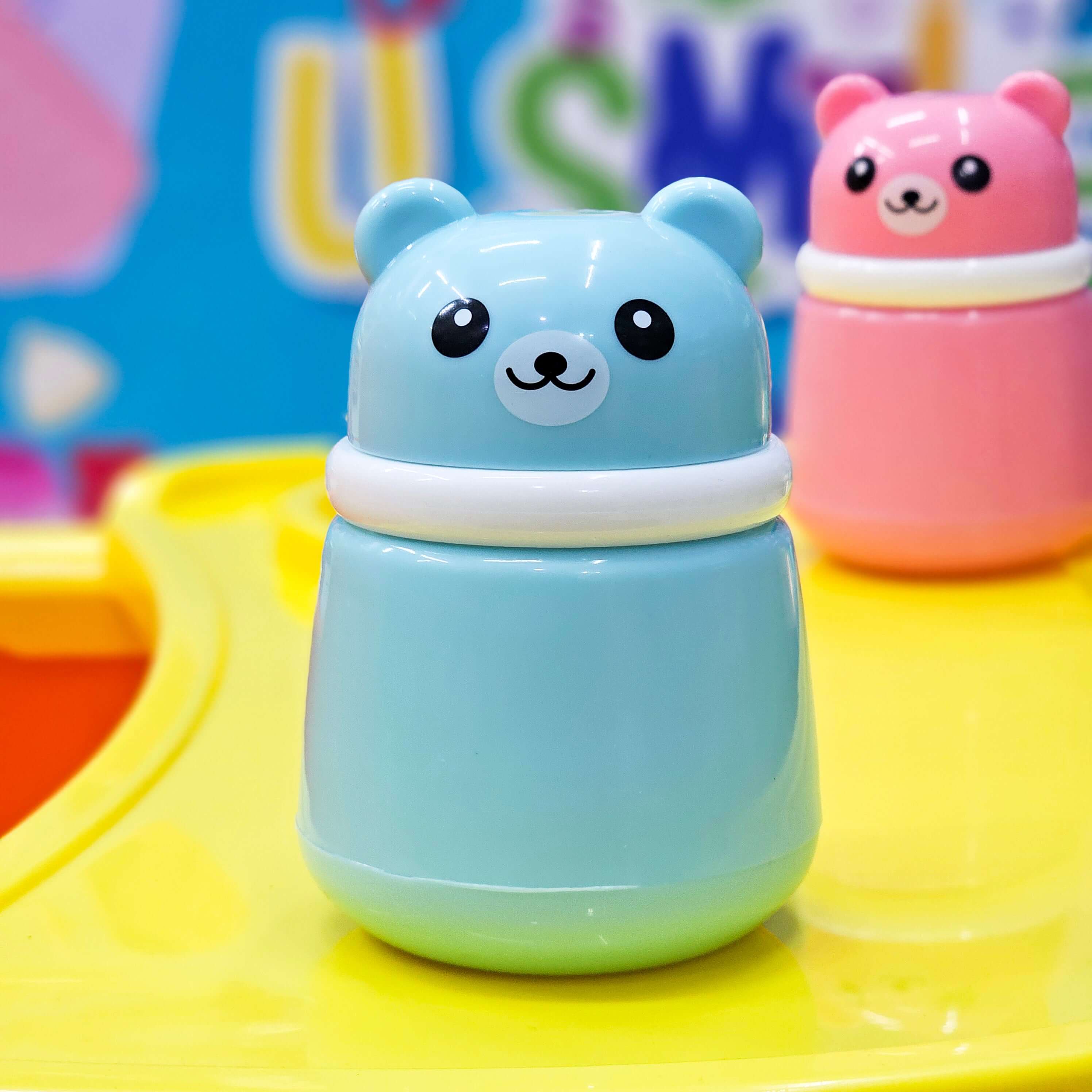 Cute pink cartoon bear-shaped powder puff case for kids, perfect for holding baby powder or talcum powder after bath time, designed for gentle application by Usmile Toys. www usmile.toys