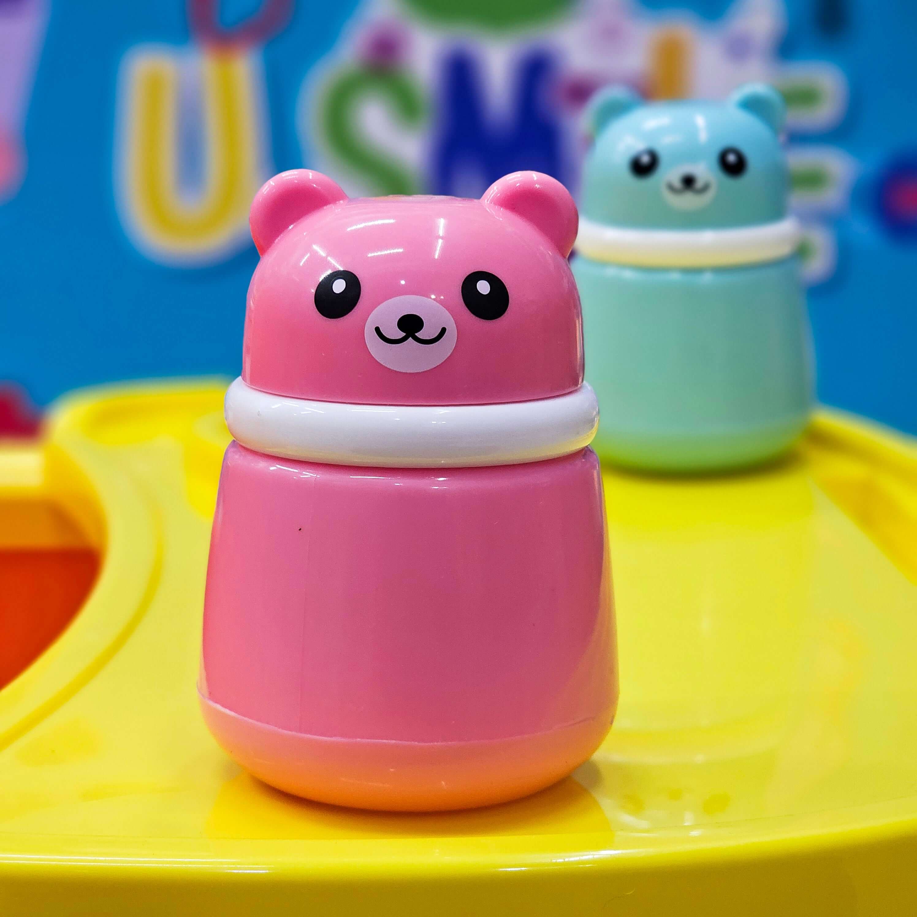 Cute pink cartoon bear-shaped powder puff case for kids, perfect for holding baby powder or talcum powder after bath time, designed for gentle application by Usmile Toys. www.usmile.toys