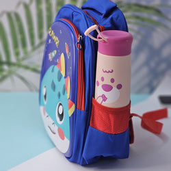 "Close-up of a Usmile Toys children's cartoon school backpack, designed in pink with a playful unicorn character on the front panel, and a matching pink water bottle in the side mesh pocket." www.usmile.toys