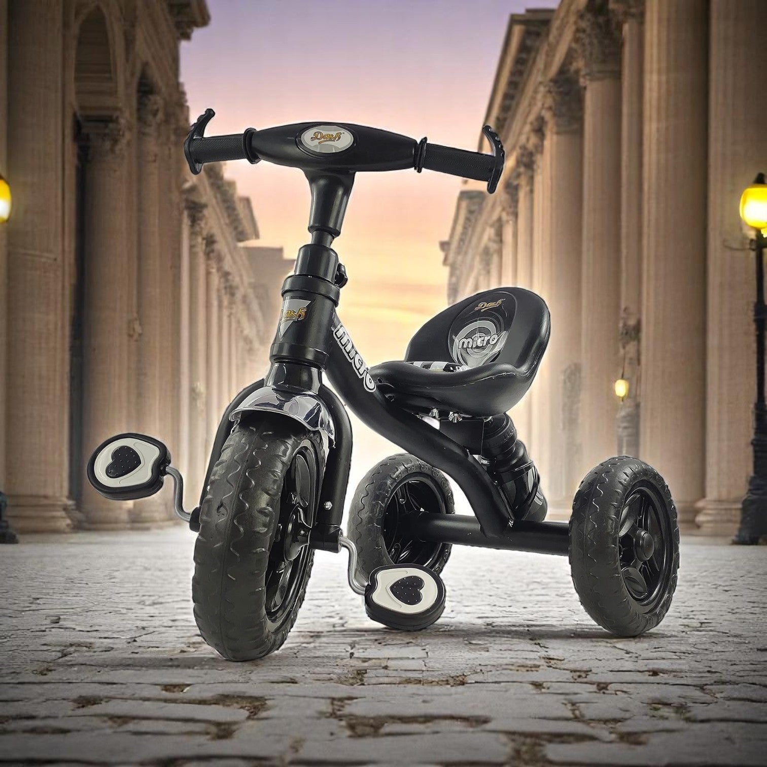 Black tricycle for children aged 3 to 5 years, with a sturdy frame and comfortable seat, in an urban setting. www.usmile.toys