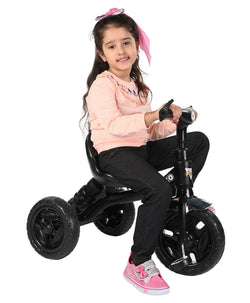 Black tricycle for children aged 3 to 5 years, with a sturdy frame and comfortable seat, in an urban setting. www.usmile.toys