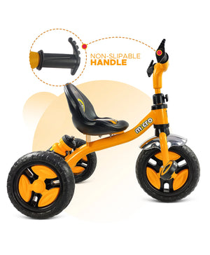 Black tricycle for children aged 3 to 5 years, with a sturdy frame and comfortable seat, in an urban setting. www.usmile.toys
