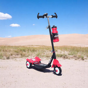 Black Fun Ride Kids Kick Scooter Rush DX with a water bottle holder, lights on wheels, and U Smile Toys branding on a grassy field www.usmile.toys