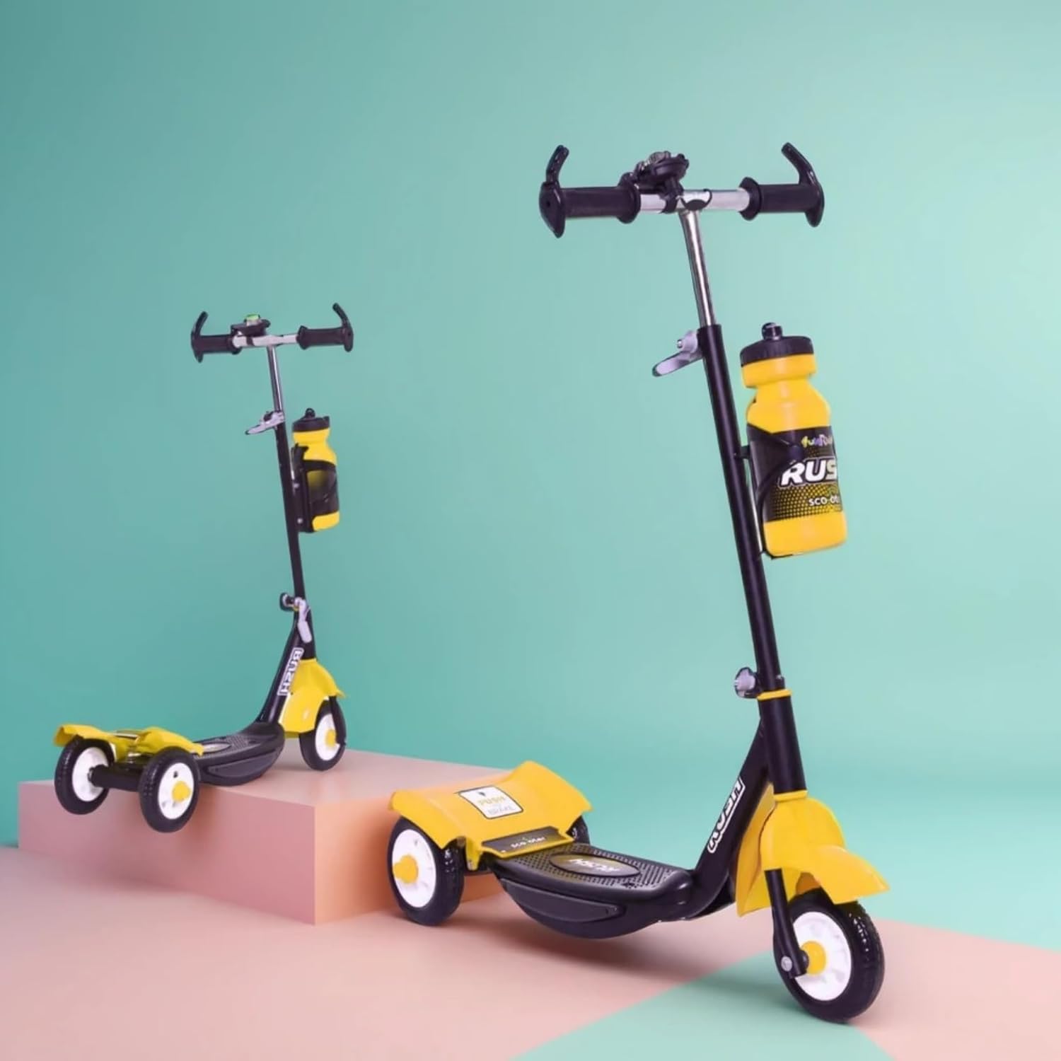 Children's Rush DX kick scooter in black with white wheels and a water bottle attachment, perfect for outdoor adventures and active play www.usmile.toys