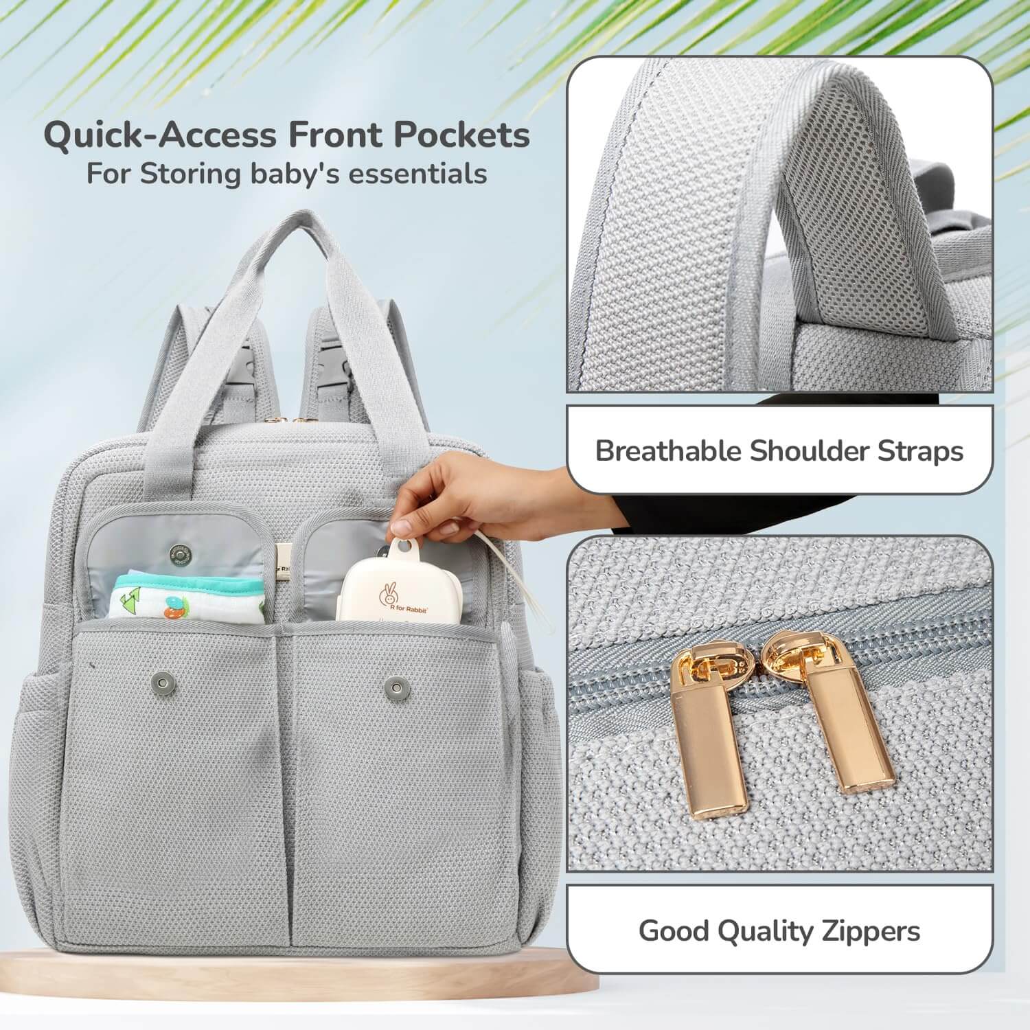 Gray diaper bag with quick-access front pockets and breathable shoulder straps on a light blue background.