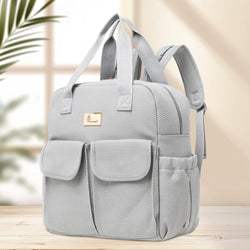 Gray backpack with a brand logo on a wooden surface with a blurred background