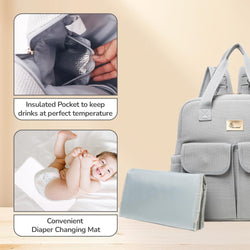 Gray diaper bag with insulated pocket and changing mat on a beige background