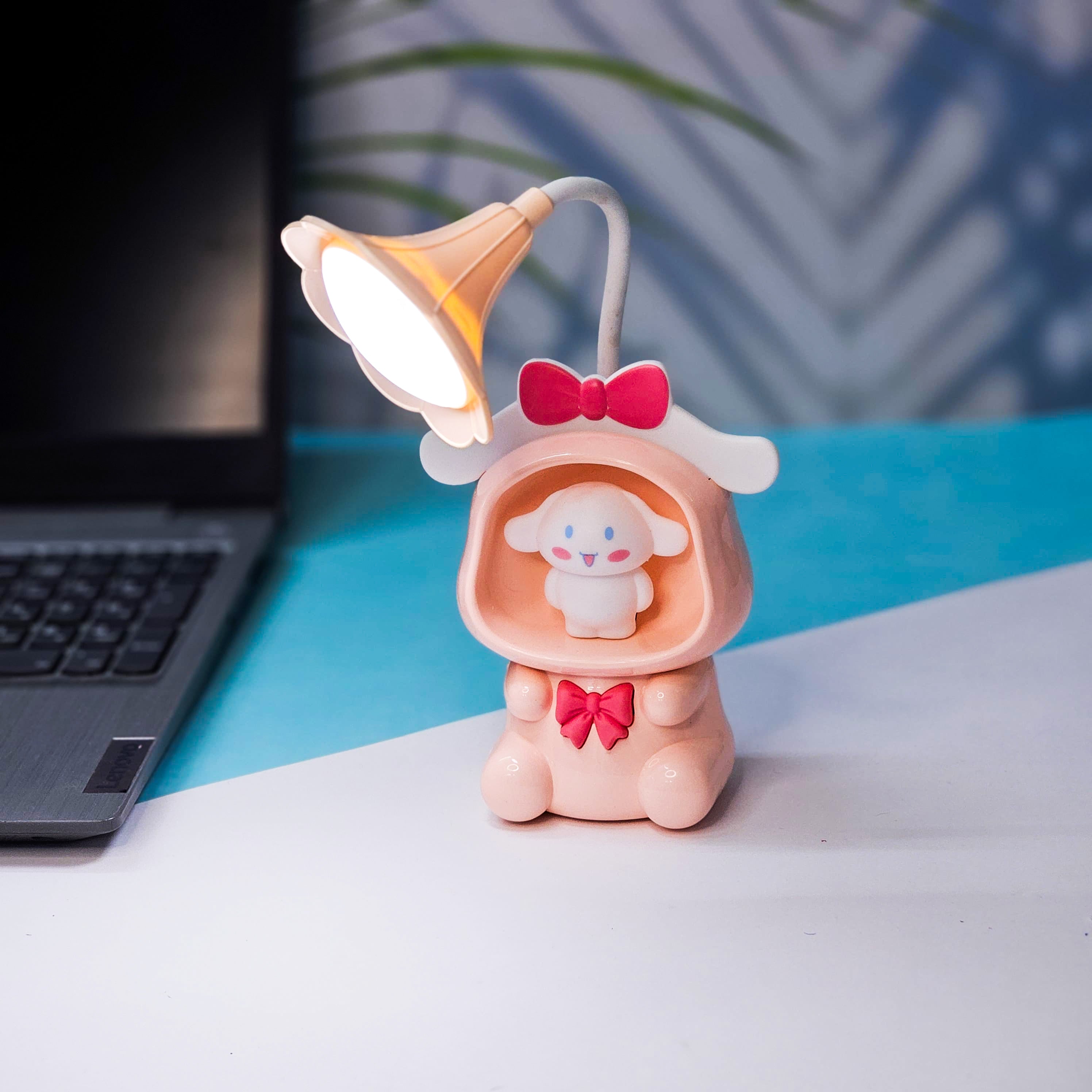 Set of three Usmile Toys Astronaut Teddy Lamps in blue, pink, and green, each featuring a glowing flower-shaped light and a base designed as a convenient pencil holder." www.usmile.toys