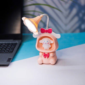 Set of three Usmile Toys Astronaut Teddy Lamps in blue, pink, and green, each featuring a glowing flower-shaped light and a base designed as a convenient pencil holder." www.usmile.toys