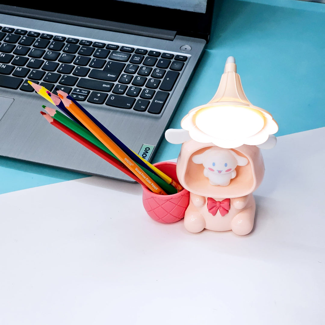 Set of three Usmile Toys Astronaut Teddy Lamps in blue, pink, and green, each featuring a glowing flower-shaped light and a base designed as a convenient pencil holder."www.usmile.toys