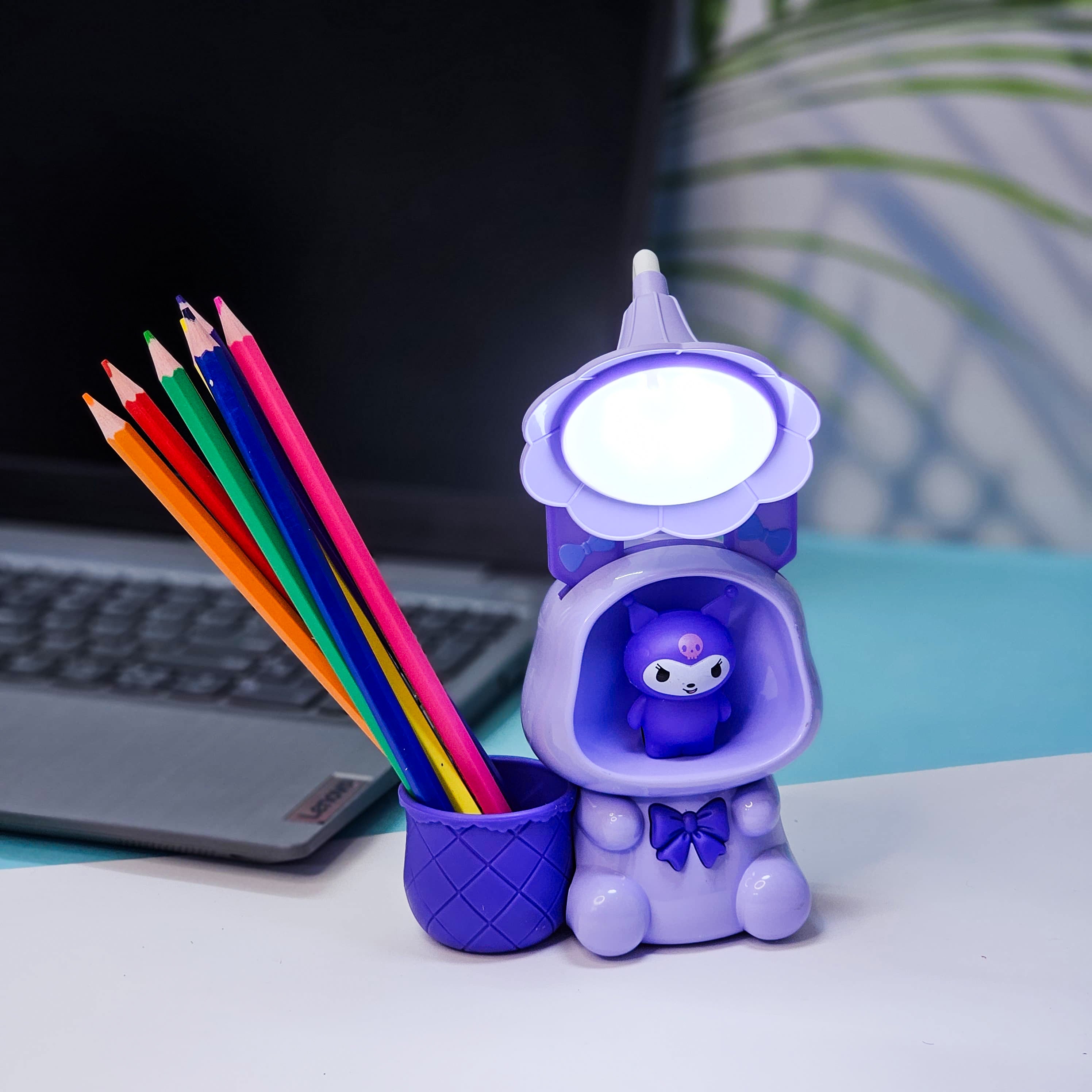Set of three Usmile Toys Astronaut Teddy Lamps in blue, pink, and green, each featuring a glowing flower-shaped light and a base designed as a convenient pencil holder."