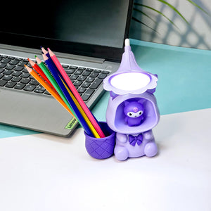 Set of three Usmile Toys Astronaut Teddy Lamps in blue, pink, and green, each featuring a glowing flower-shaped light and a base designed as a convenient pencil holder."