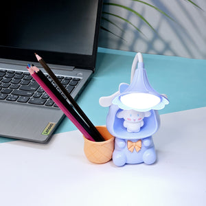 Set of three Usmile Toys Astronaut Teddy Lamps in blue, pink, and green, each featuring a glowing flower-shaped light and a base designed as a convenient pencil holder." www.usmile toys