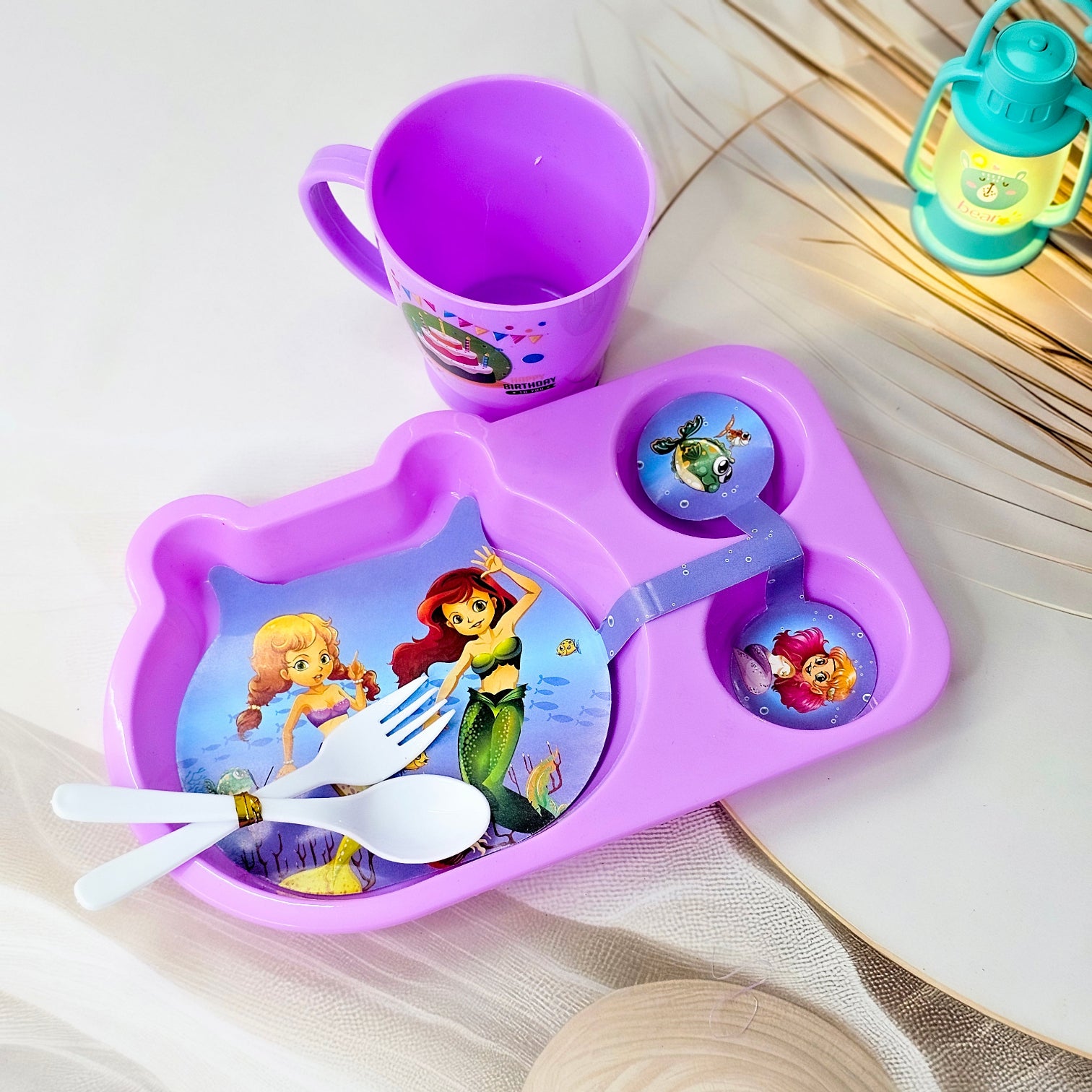 Usmile Toys playful cartoon toddler dining set in pink with a unicorn design, including a segmented plate, cup, and cutlery. www.usmile.toys